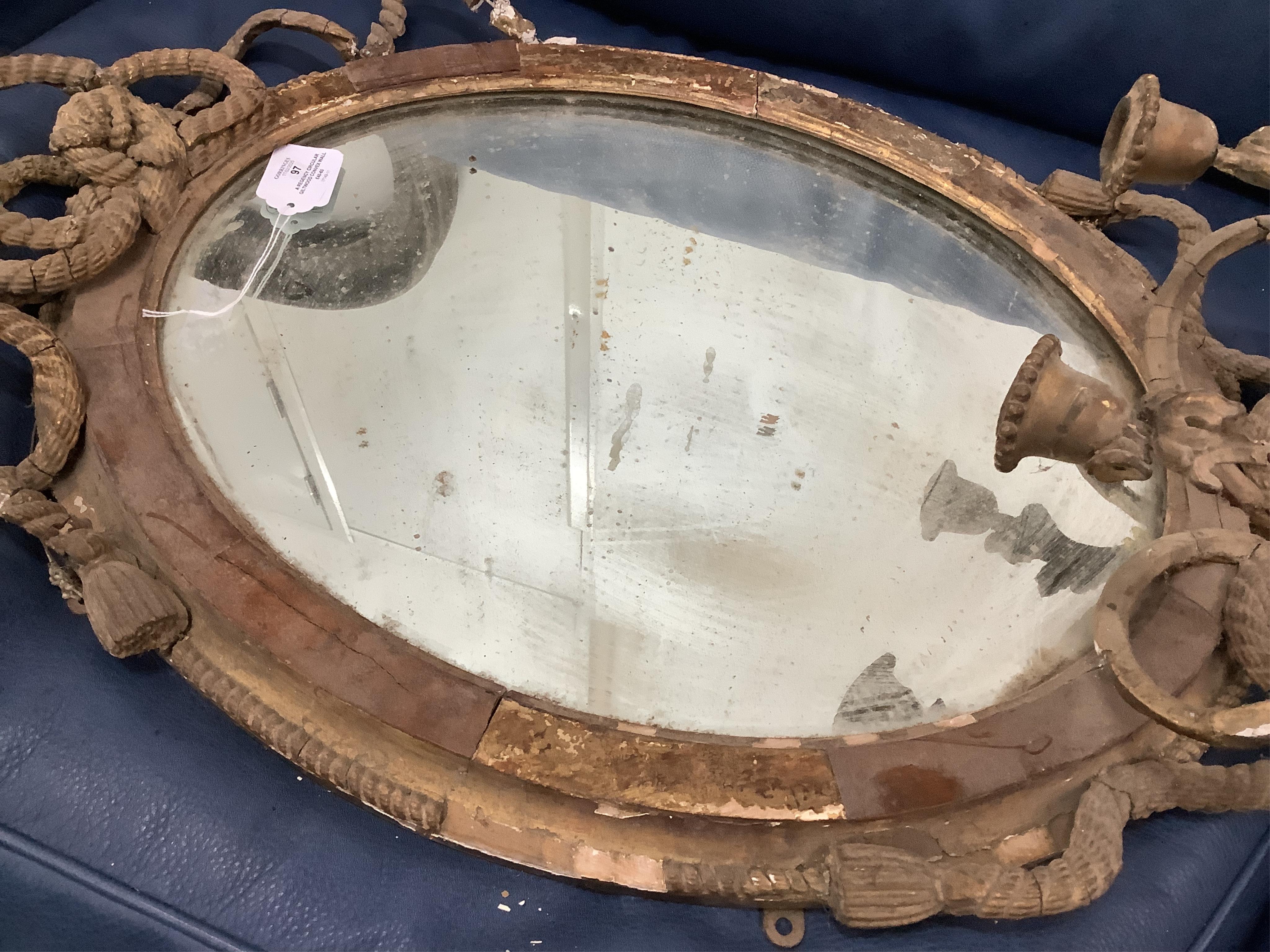 A Regency circular giltwood convex wall mirror with lion pediment, diameter 65cm a Regency convex mirror frame and Victorian girandole. Condition - poor